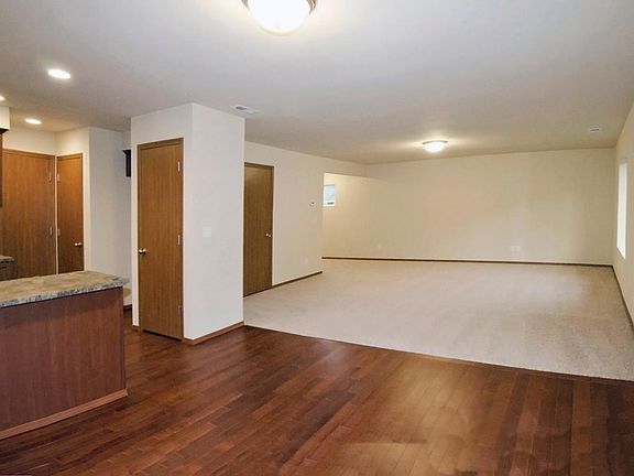 Open concept main floor with hardwood in the kitchen and dining areas