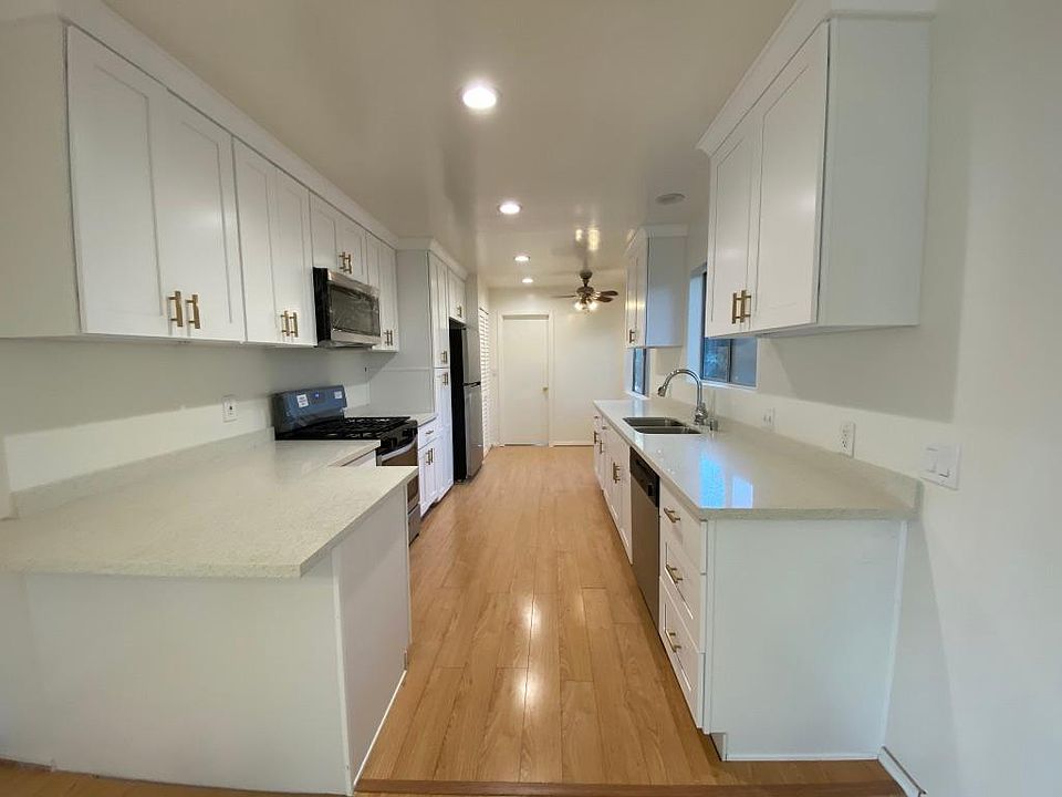 Newly renovated Kitchen with Quartz Countertop, brand new stainless appliances.