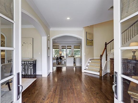 Wide open entry with hardwoods. Study off to the right and dining room to the left