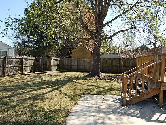 Large yard has double gate access.