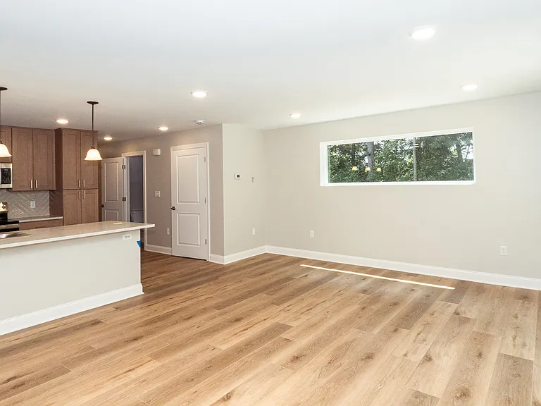Living room with large window adding tons of natural light