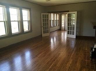 Living Room. Wood floors, mock fireplace with lots of light