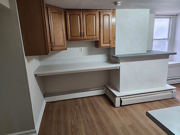 Kitchen work area with extra cabinets and bluestone bar area