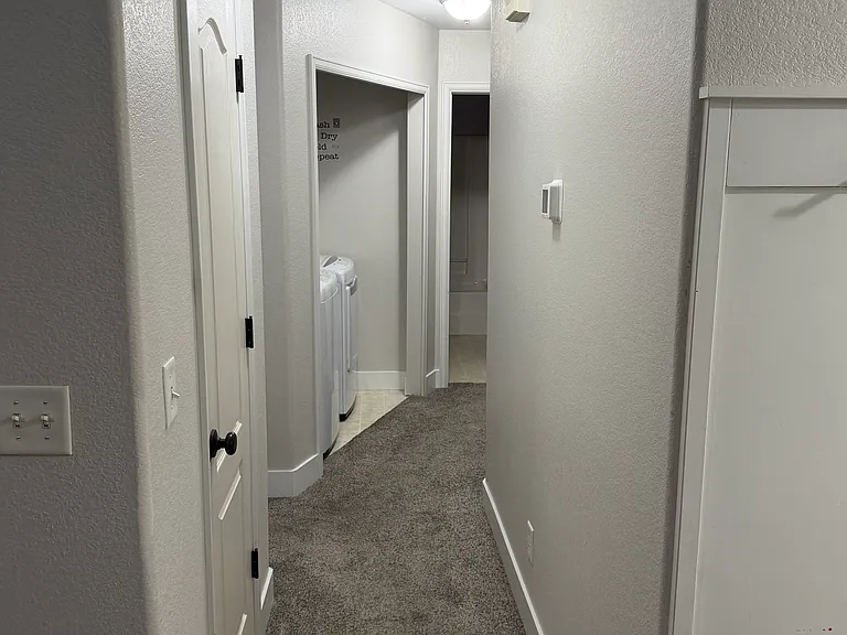 Hallway shot. Master bedroom to the left and the other two rooms to the right