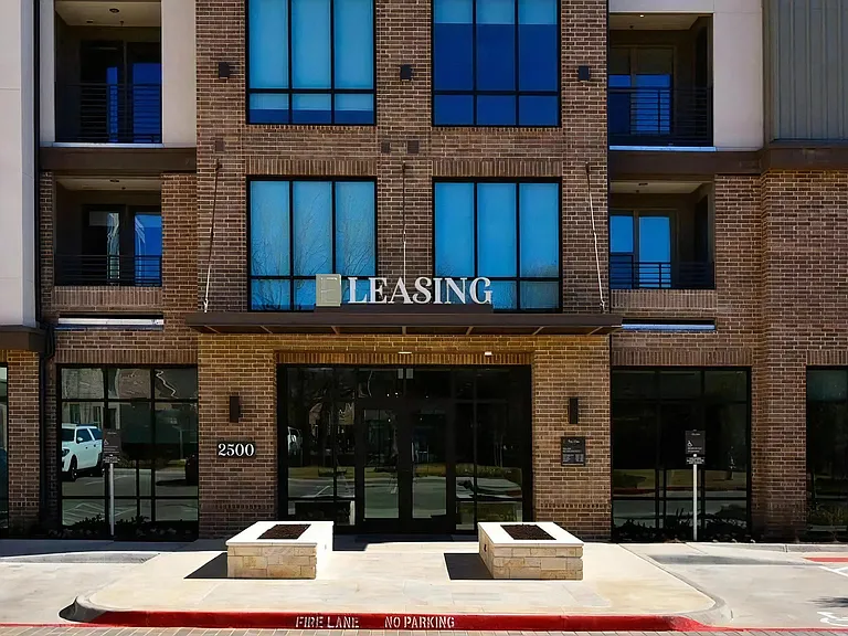 Modern Leasing Office Entrance with Floor-to-Ceiling Windows