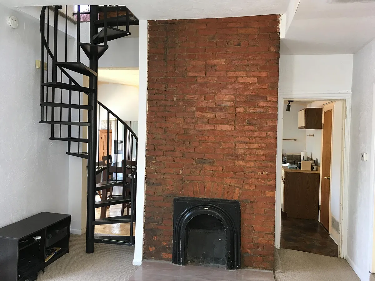 Stunning architectural details _ spiral staircase and original exposed brick. - 721 Ivy St #2R