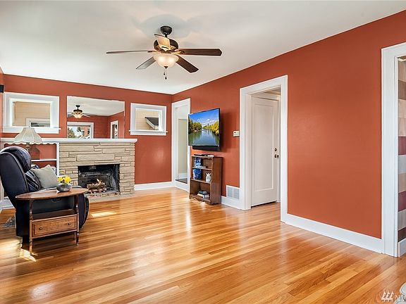 Covered front porch and gated white picket fence