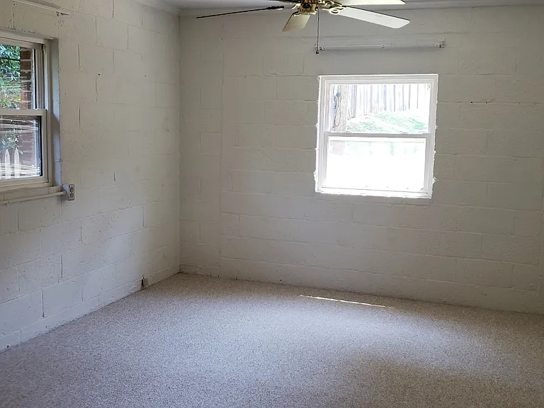The bedroom is almost as long as the living room, quite large!