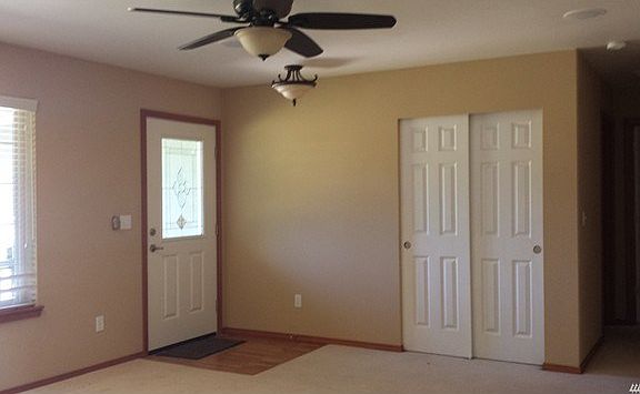 Living room, with ceiling fan and skylight(not pictured). Surround sound in all rooms!