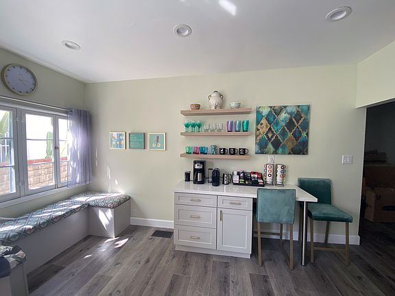 Coffee bar with counter and bench storage.