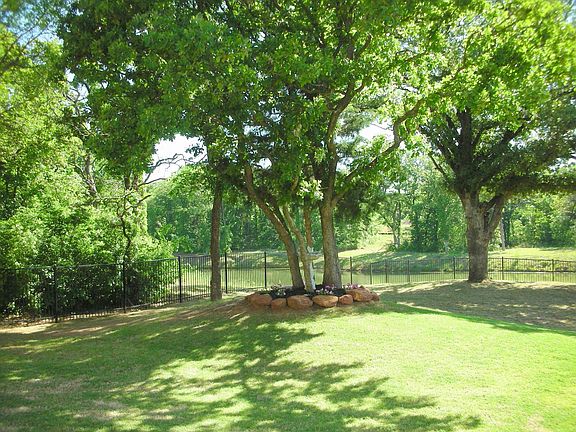 Large Fenced Backyard w/Mature Trees overlooks Lake