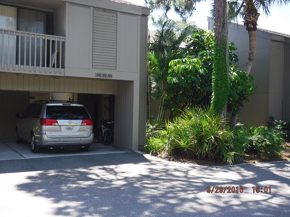 Carport and entrance to #306