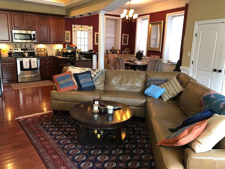 Open layout living room with high ceiling and dimable lights