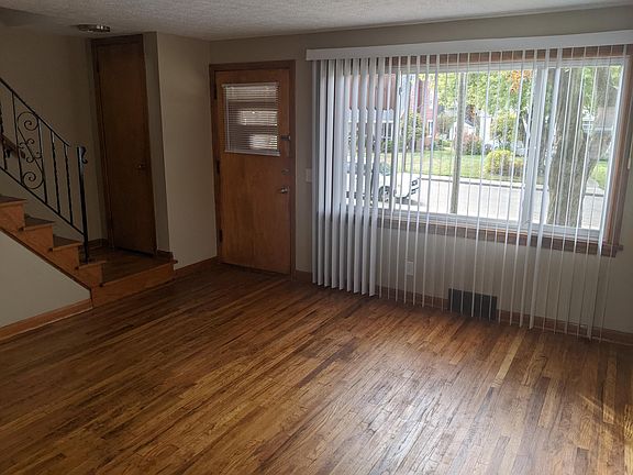 living room with new verticle blinds