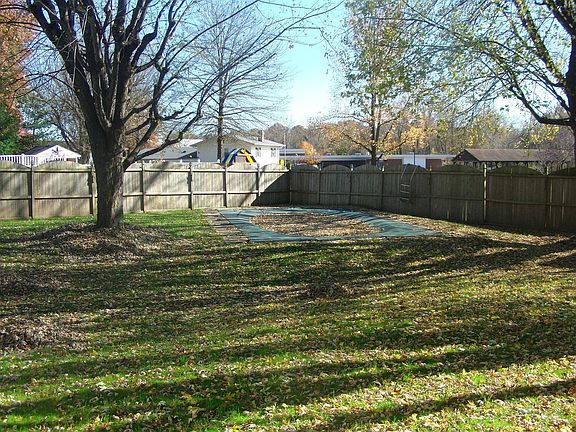 View of pool & fenced back yard