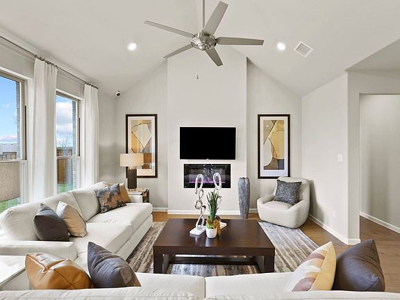 Living room in the Masters home plan by Trophy Signature Homes - REPRESENTATIVE PHOTO