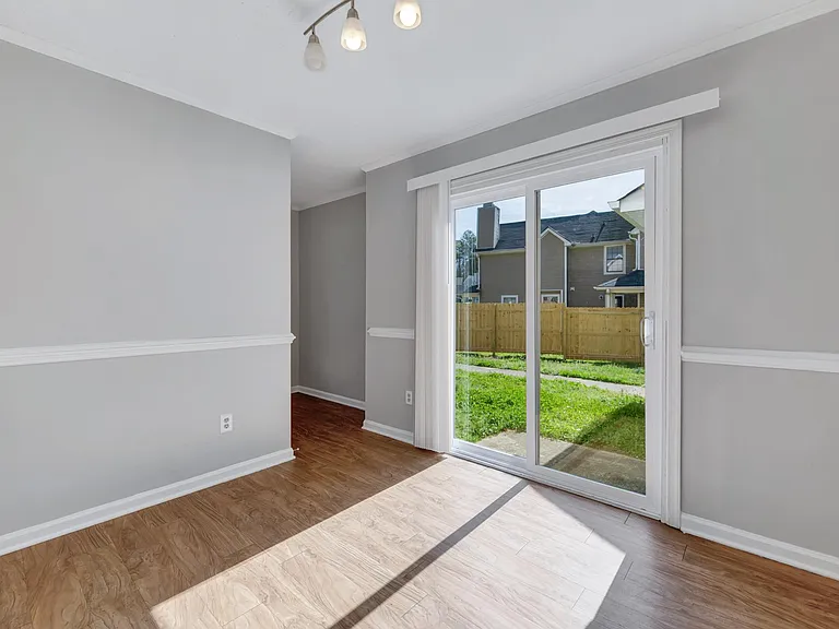 The dining room has new lovely sliding glass doors that open right up to a great backyard for pets