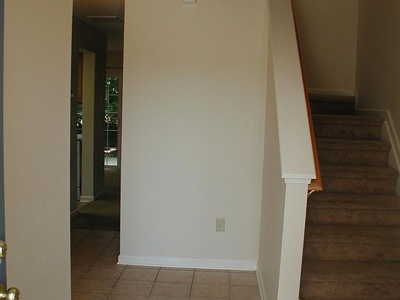 Tiled foyer with closet