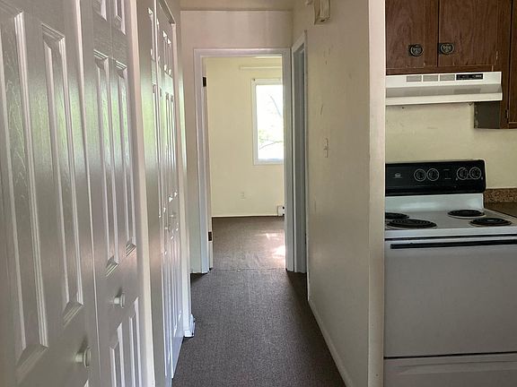 Hallway connecting kitchen, bathroom and bedroom.