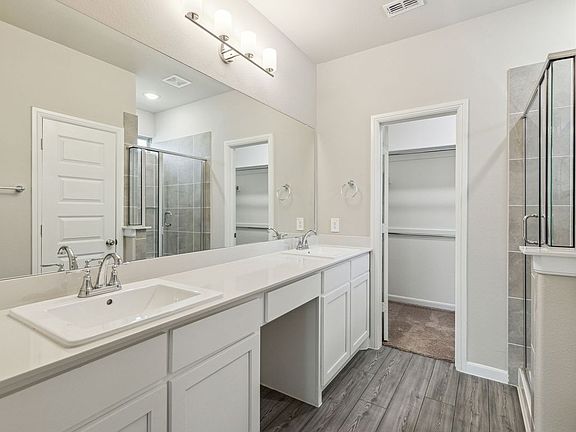 Primary Bathroom in the Pearl home plan by Trophy Signature Homes - REPRESENTATIVE PHOTO