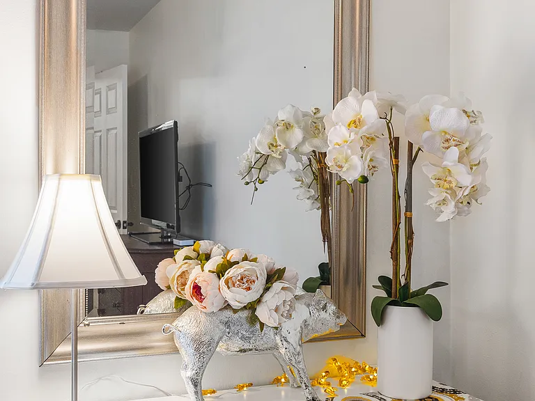 Comfortable King bed in the bedroom. Includes a smart TV, desk to get ready at, dresser and a closet to store your items in.