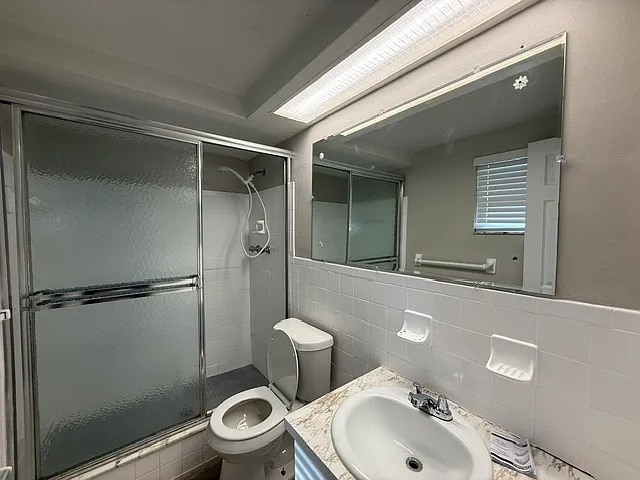 New shower head and toilet in master bath