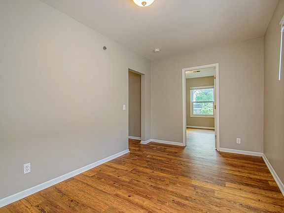 Living room, kitchen is behind in this photo