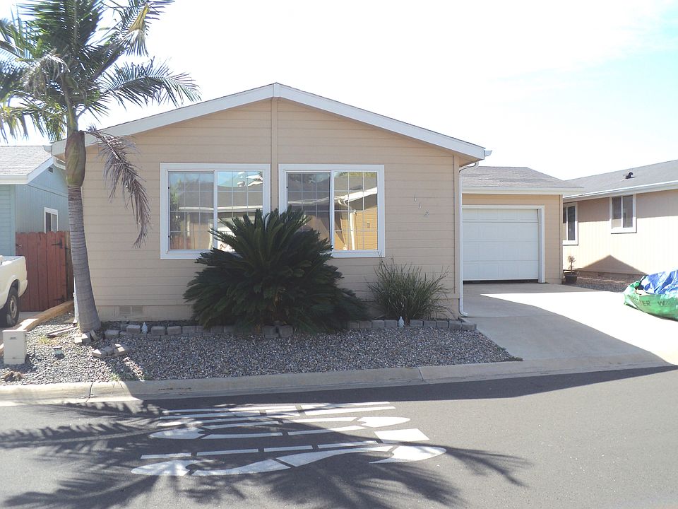 Front exterior w/sago palm