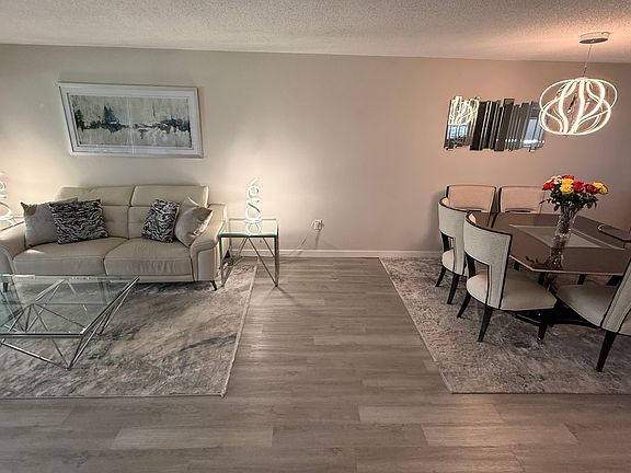 Marge Carson Dining Table & 6 Chairs Reclining on 2 sides leather sofa