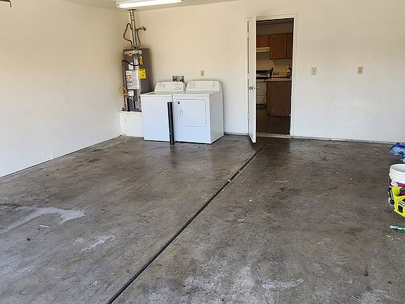 Two car garage with laundry with entrance to kitchen. Very convenient!