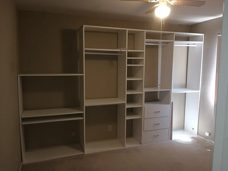 Second bedroom with built-in, mirror closet doors and ceiling fan