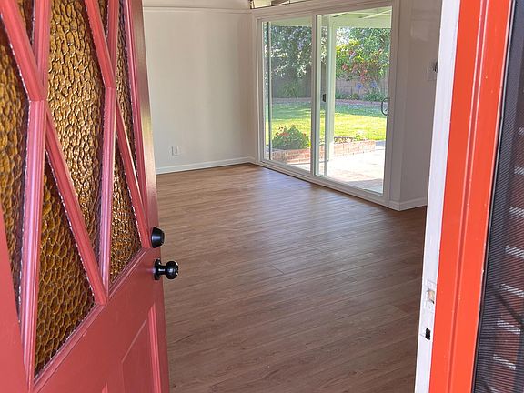 Charming bungalow door and exposed beams with all new interior. Classic, warm and charming