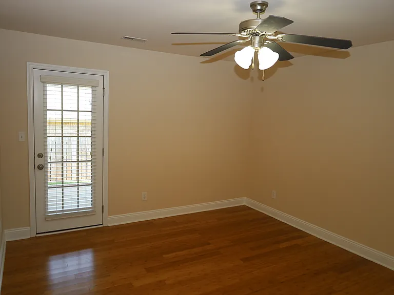 Primary bedroom, door to backyard
