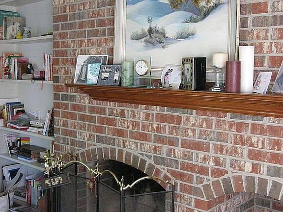 Floor-to-ceiling FP and Bookshelves in Family Room