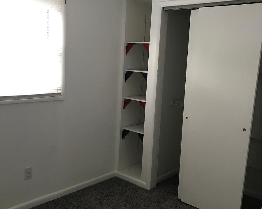 Bedroom with large closet, bookshelves and new Carpet