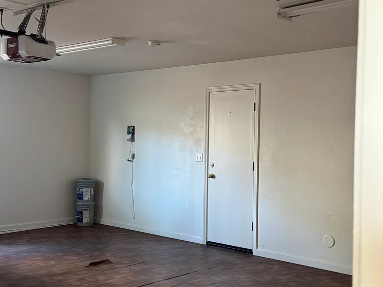 Double Wide Door Garage (20' x 23') with access to narrow back yard and large fenced side yard.
