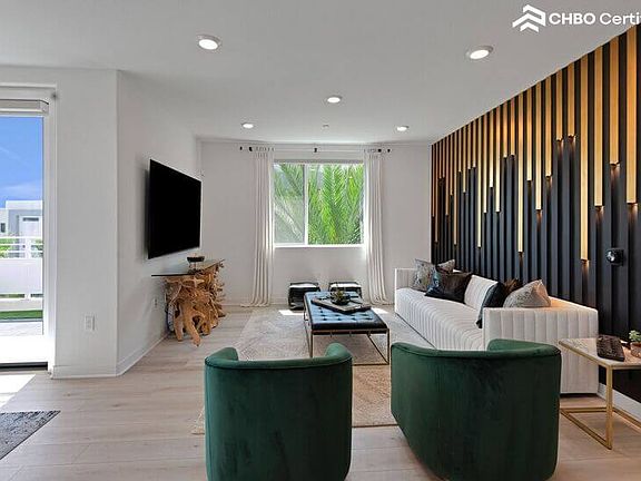 Spacious Great Room with 77" Sony OLED & LED Slatted Wall