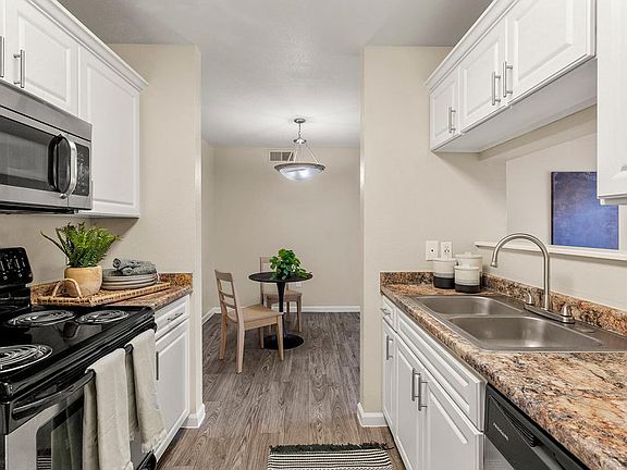 The kitchen offers plenty of cabinet space as well and opens up into the dining and living room; perfect for entertaining!