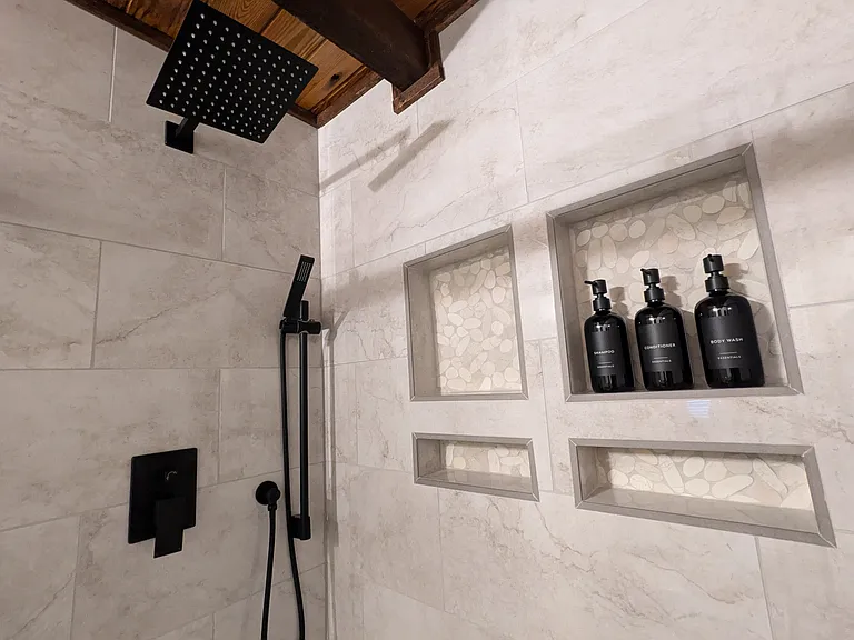 Main Level Walk-In Master Shower with Rainfall Showerhead. (starter Shampoo, Conditioner, and Body Wash Provided)