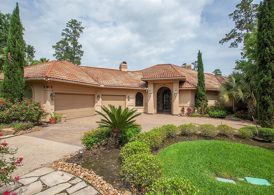 Exquisite Mediterranean situated on 1/2 acre private corner lot.