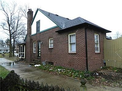 Large screened-in porch, working fireplace, 2 car garage, large, private back deck.