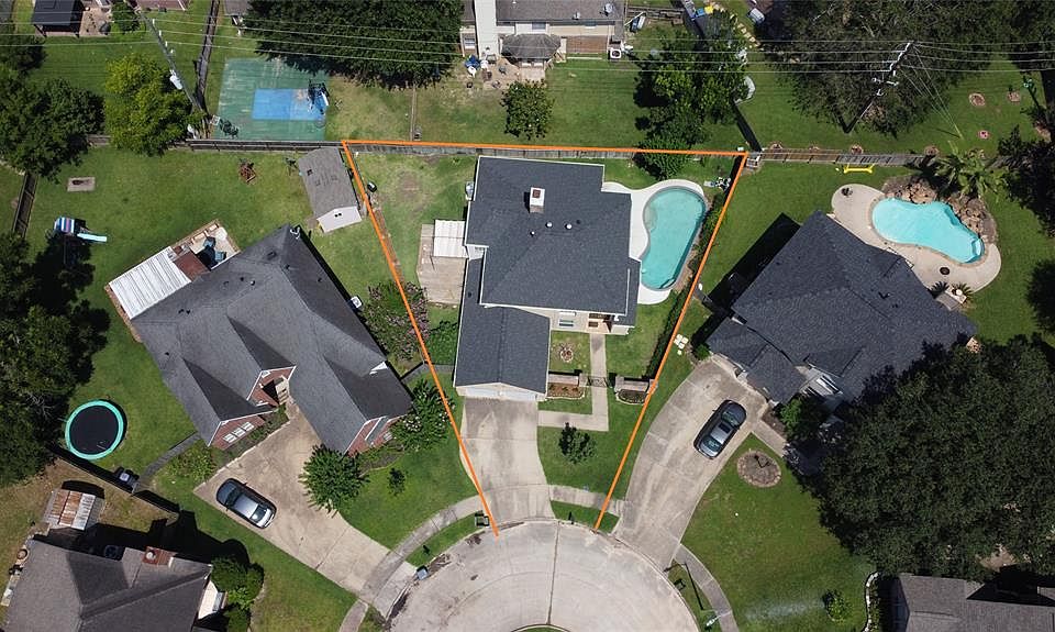 Aerial view of 14611 W. Rutledge Ct. showing location of POOL and decking plus how home is situated on the cul-de-sac