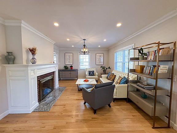 Open concept living area with wood burning fireplace