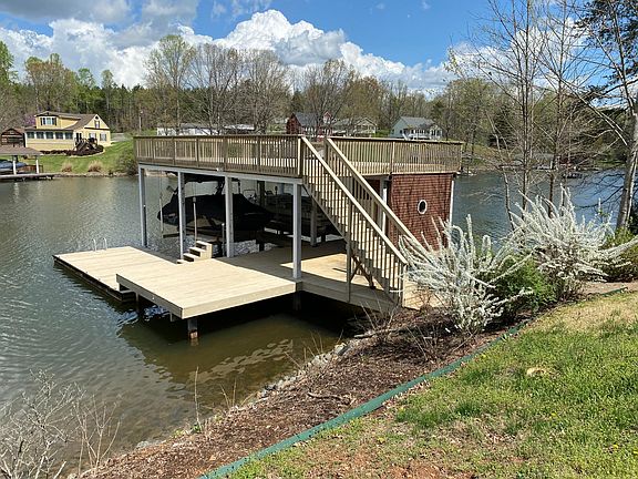 Large fixed dock with 2 boat lifts and floating dock