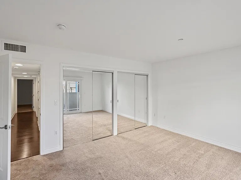 Bedroom with Two Mirrored Closets