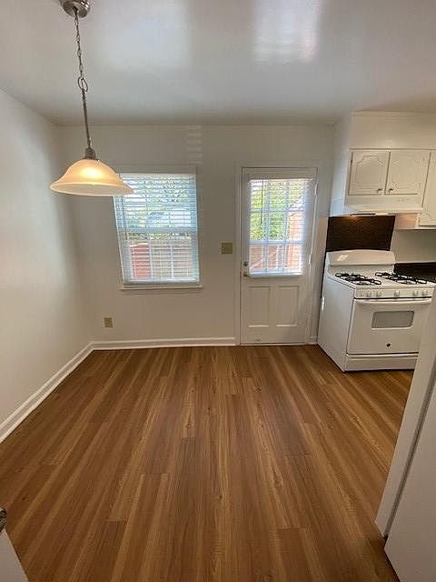 Hardwood like flooring in 2 BR Townhome breakfast room and kitchens. Gas cooking in select units.