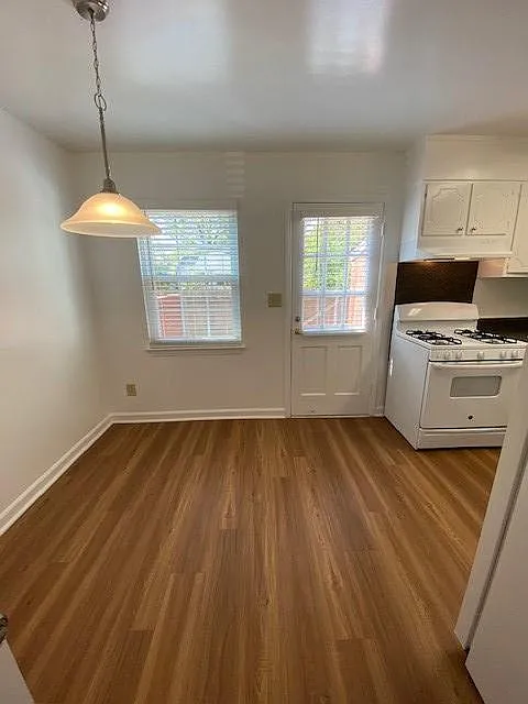 Hardwood like flooring in 2 BR Townhome breakfast room and kitchens. Gas cooking in select units.