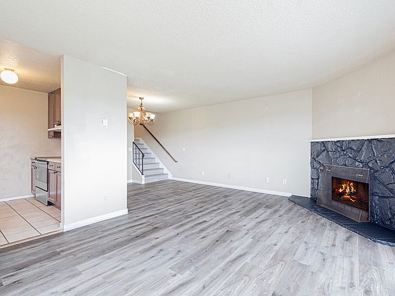 Spacious living room with wood burning fireplace