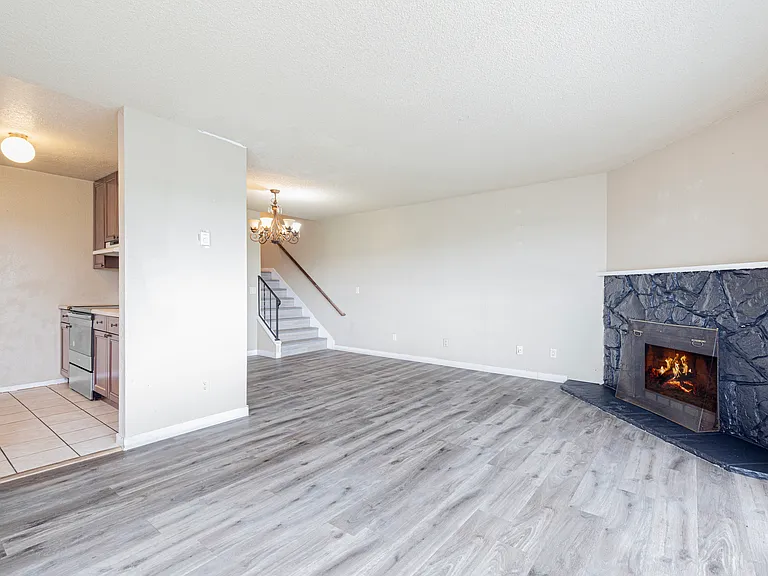 Spacious living room with wood burning fireplace