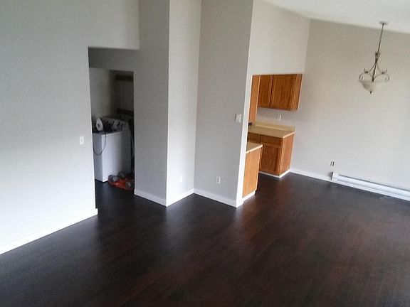 Living room looking toward kitchen and dining area